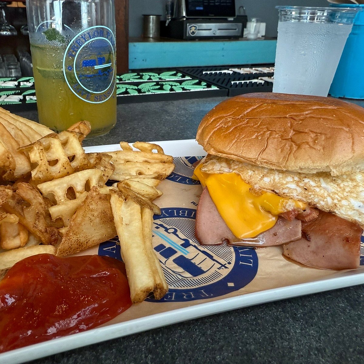 Treylor Park signature dishes Smash BurgerPB & J WingsShrimp and Grits Tacos